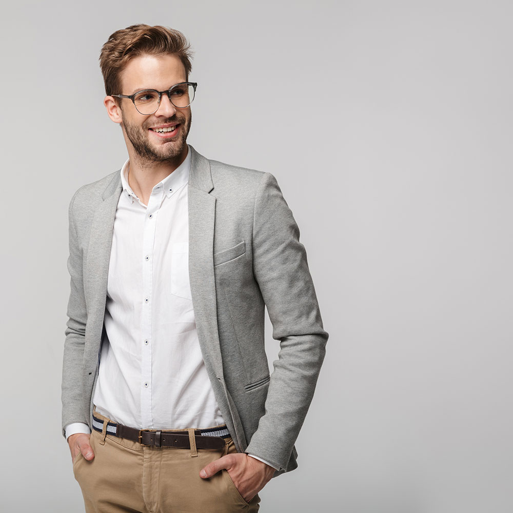 portrait-of-happy-young-businessman-posing-at-came-3MRXVKU.jpg